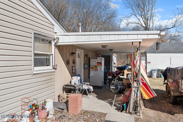 exterior space with a carport