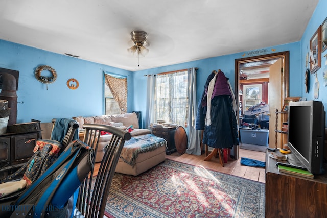 interior space featuring visible vents, ceiling fan, and wood finished floors