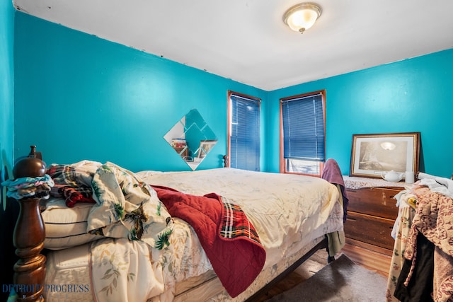 bedroom with wood finished floors