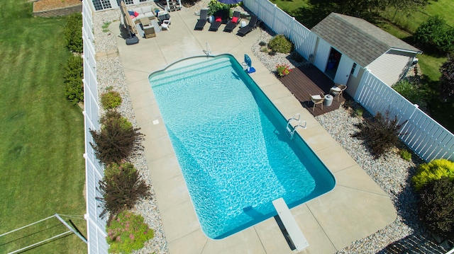 view of pool featuring a fenced in pool, a yard, a fenced backyard, and a patio area