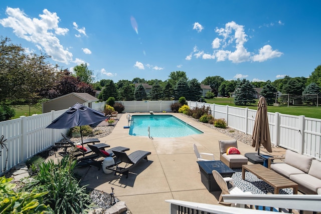 view of swimming pool with a fenced in pool, a fenced backyard, outdoor lounge area, and a patio area