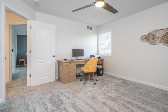 office with baseboards, carpet, visible vents, and ceiling fan