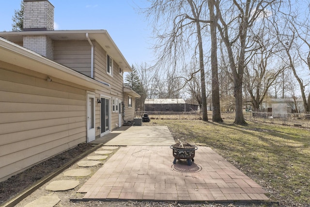 view of patio / terrace with a fenced backyard and an outdoor fire pit