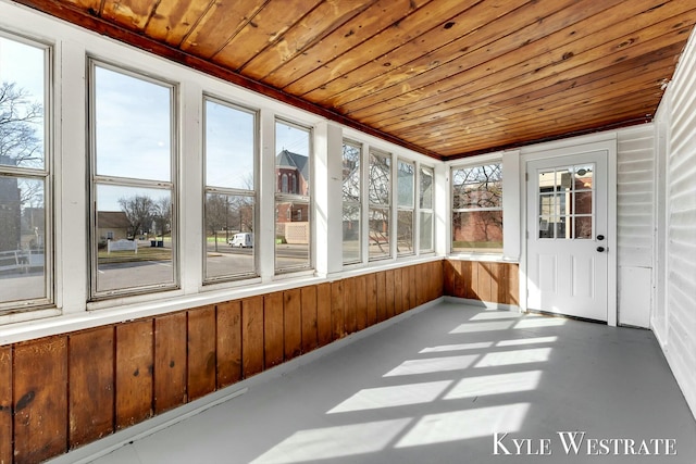 unfurnished sunroom featuring wood ceiling