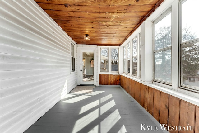 unfurnished sunroom featuring wooden ceiling