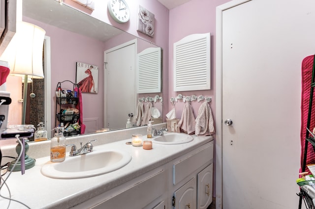 full bath featuring a sink and double vanity