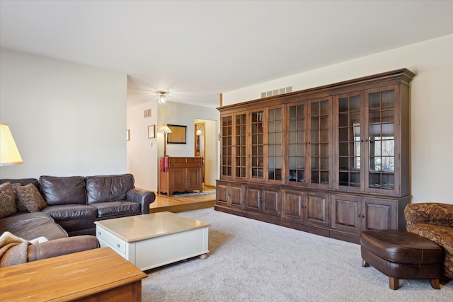 living room with visible vents and carpet floors