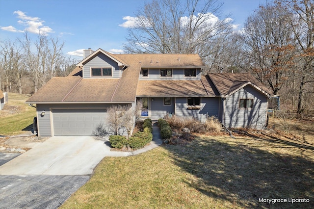 view of front of property with concrete driveway, a front yard, roof with shingles, and a chimney