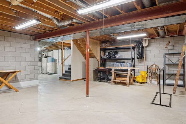 unfinished below grade area with gas water heater and stairway