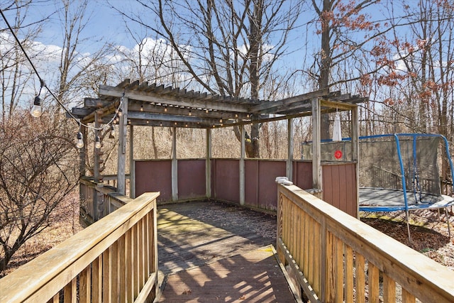 wooden terrace with a trampoline