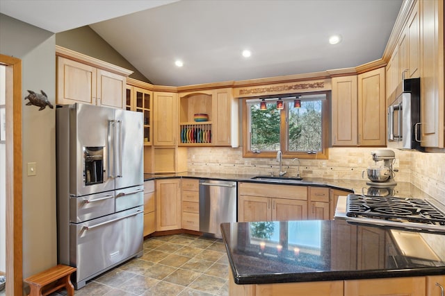 kitchen featuring a sink, stainless steel appliances, and light brown cabinets