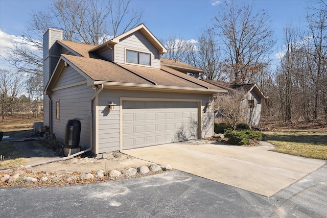 view of home's exterior with a chimney, driveway, a shingled roof, and a garage