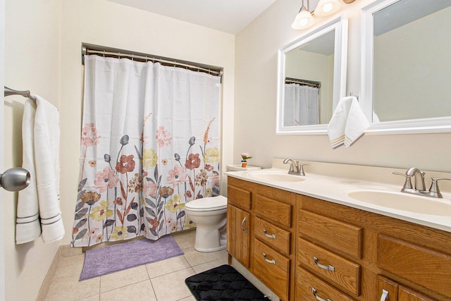 full bathroom with a sink, toilet, double vanity, and tile patterned flooring