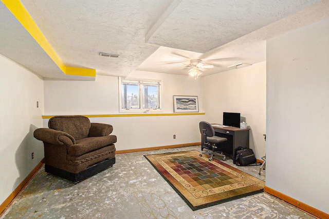 office area with ceiling fan, baseboards, visible vents, and a textured ceiling