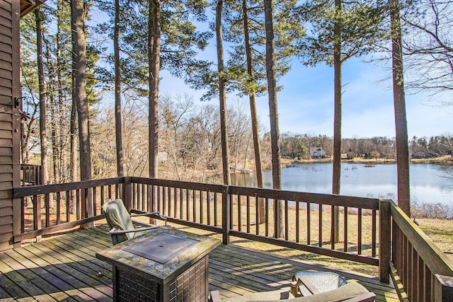 wooden deck featuring a water view