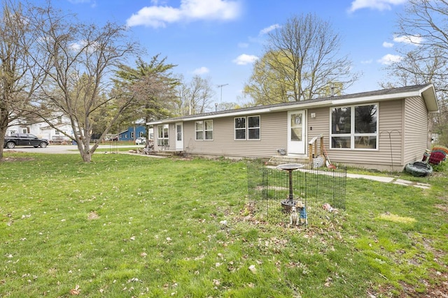 ranch-style house with a front lawn and entry steps