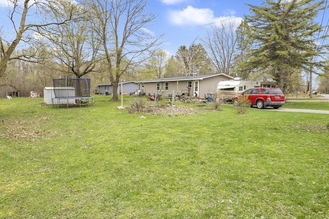 view of yard featuring a trampoline