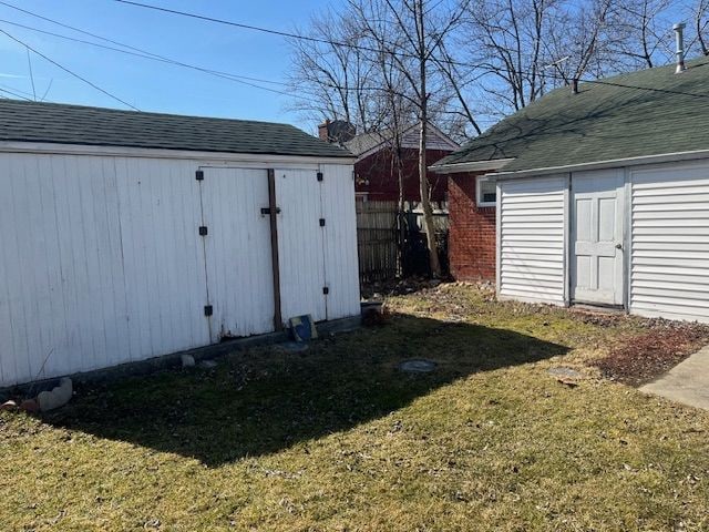 view of shed with fence