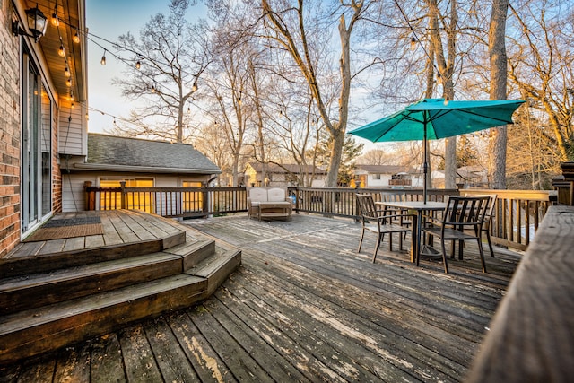 deck with outdoor dining space