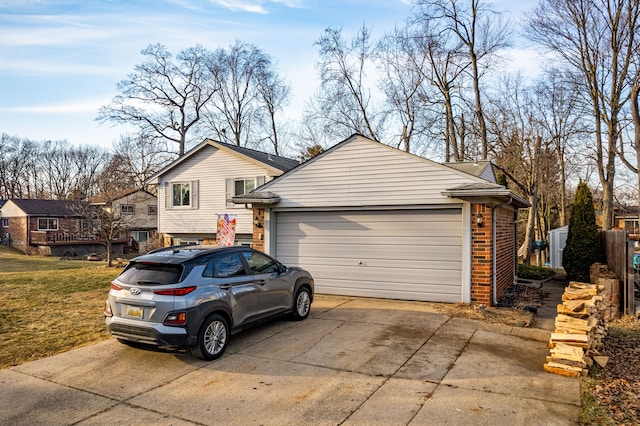 view of front of home with brick siding and a garage