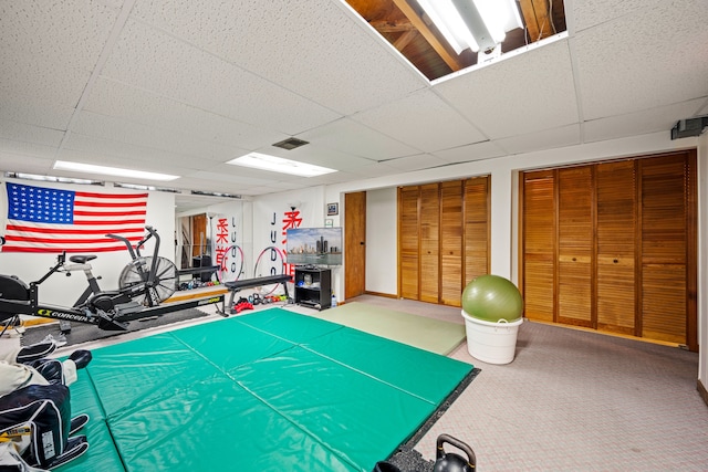 playroom with visible vents and a drop ceiling