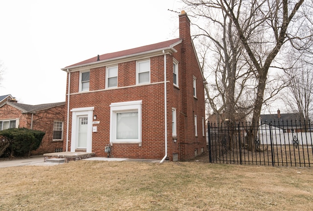 view of front of property featuring a front lawn, fence, brick siding, and a chimney