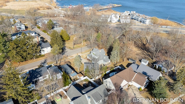 bird's eye view featuring a residential view and a water view