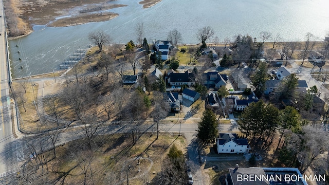 birds eye view of property with a residential view and a water view