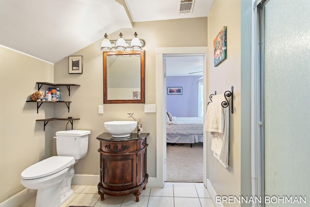 full bath with visible vents, tile patterned flooring, vaulted ceiling, toilet, and connected bathroom