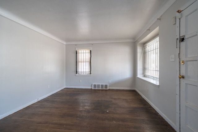 interior space with visible vents, plenty of natural light, baseboards, and wood finished floors