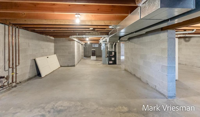 unfinished basement with heating unit