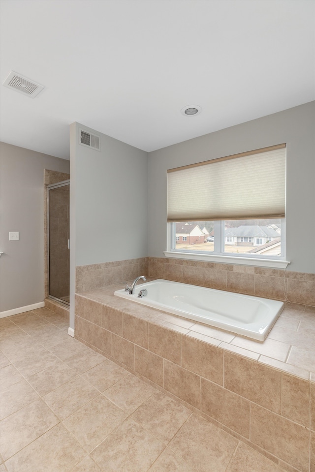 bathroom with a garden tub, visible vents, a stall shower, and tile patterned floors