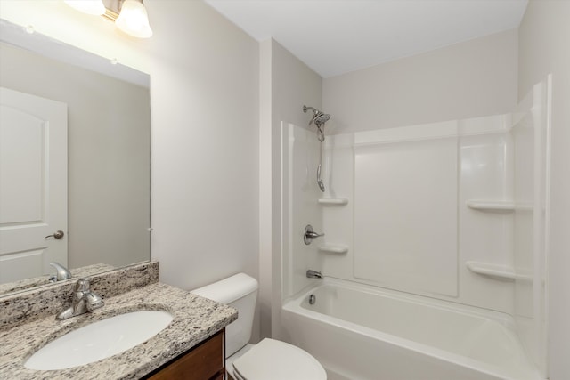 bathroom featuring toilet, vanity, and shower / bathtub combination