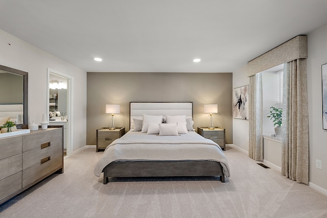 bedroom featuring recessed lighting, baseboards, and light carpet