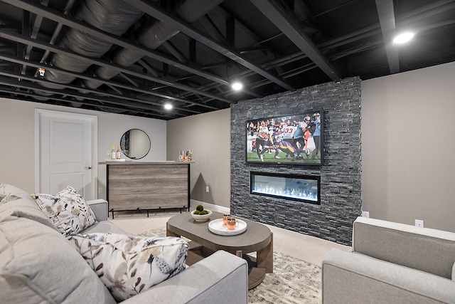 living room featuring a stone fireplace