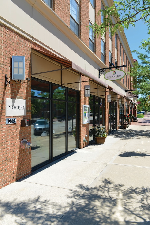 property entrance with brick siding