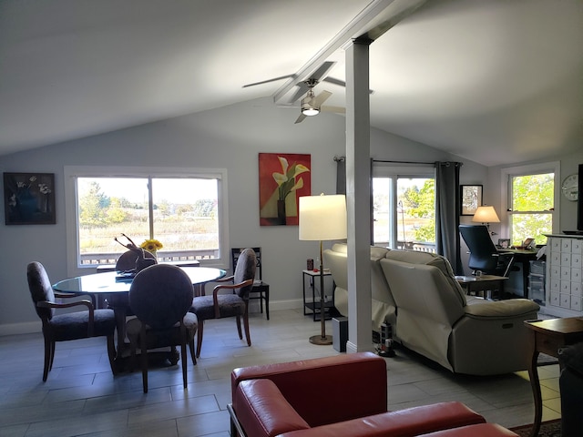 living room featuring baseboards, a ceiling fan, and vaulted ceiling with beams