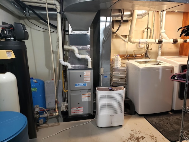 utility room with washing machine and dryer