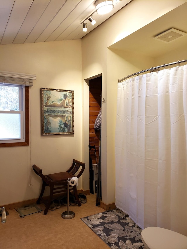 bathroom with visible vents, baseboards, and toilet