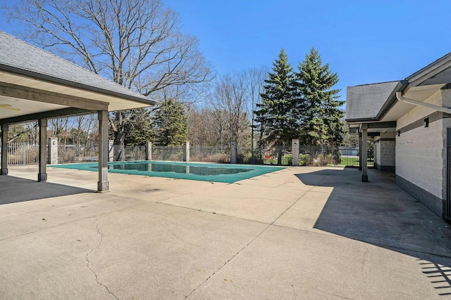 view of pool featuring a patio area, a fenced in pool, and fence