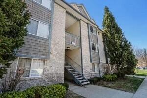 view of property exterior featuring stairs