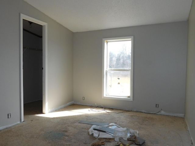 unfurnished bedroom with multiple windows