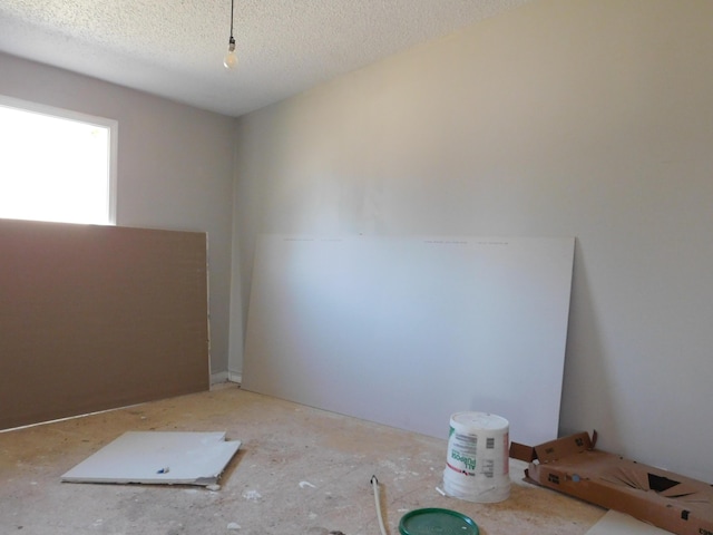 empty room featuring a textured ceiling