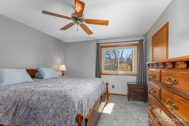 bedroom featuring a ceiling fan, baseboards, and light carpet