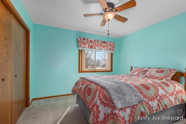 bedroom with ceiling fan, carpet, a closet, and baseboards