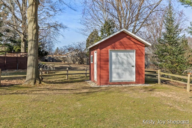 view of shed with fence