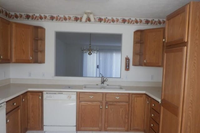 kitchen featuring dishwasher, open shelves, brown cabinetry, and a sink