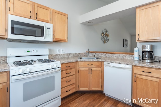 kitchen featuring a sink, white appliances, light brown cabinetry, and light countertops