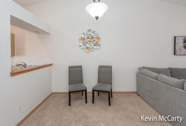 sitting room with baseboards and carpet floors