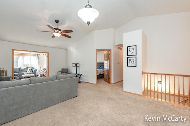 living room with a ceiling fan, carpet, visible vents, baseboards, and lofted ceiling